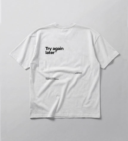 White t-shirt with 'Try again later' text on a light gray background