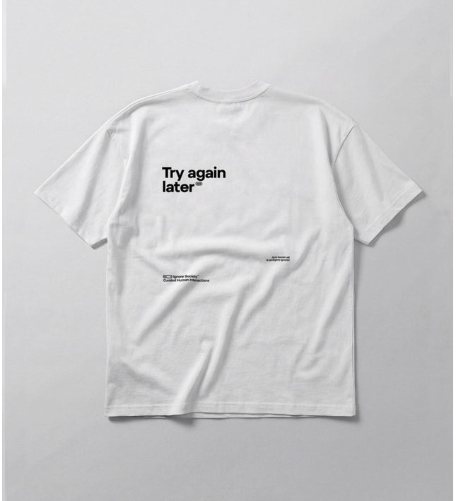 White t-shirt with 'Try again later' text on a light gray background