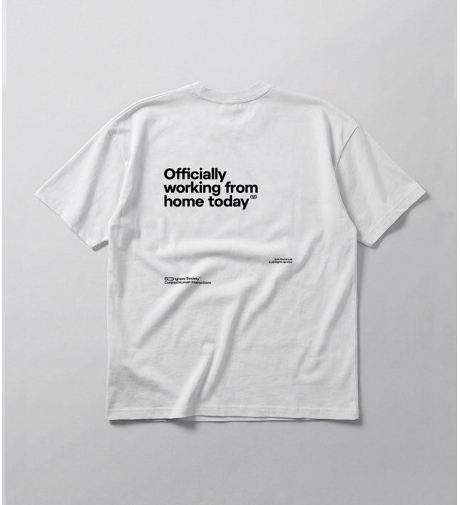 White t-shirt with text 'Officially working from home today' on a light gray background