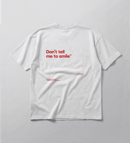 White t-shirt with red text on a gray background