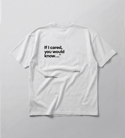 White t-shirt with black text on a light gray background