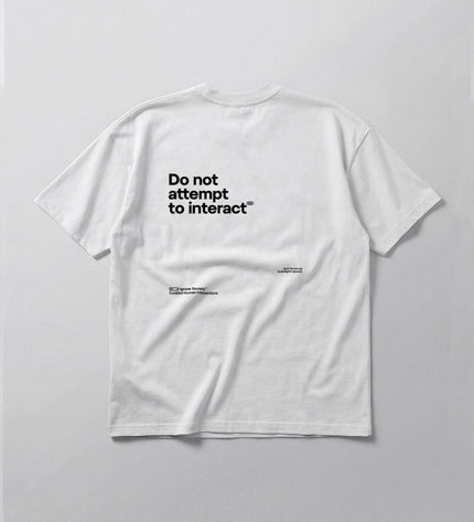 White t-shirt with black text on a light gray background