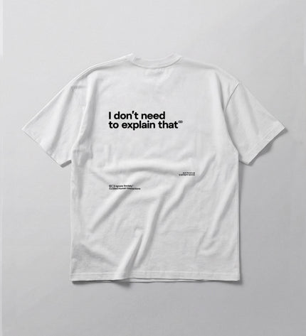 White t-shirt with black text on a light gray background