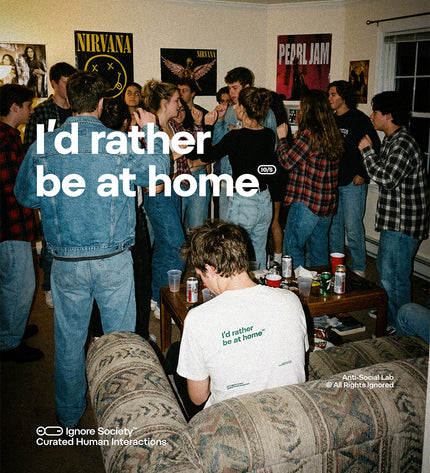 People in a room with posters on the wall, sitting on a couch with text overlay.