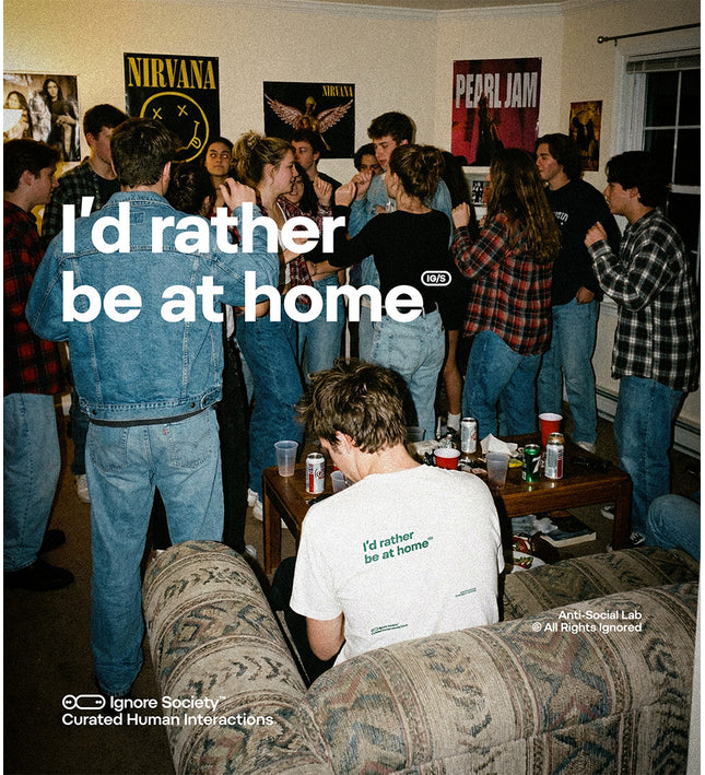 People in a room with posters on the wall, sitting on a couch with text overlay.