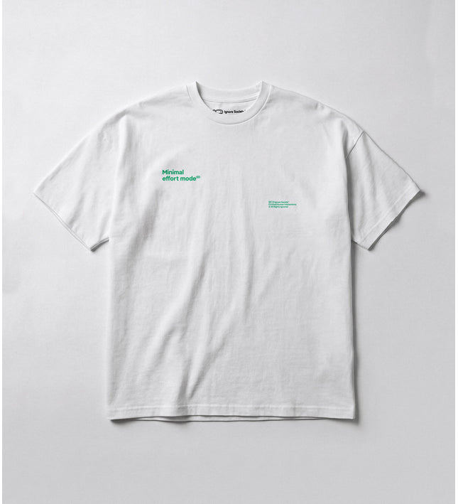 White t-shirt with green text on a light gray background