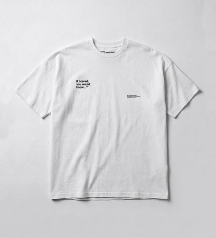 White t-shirt with black text on a light gray background