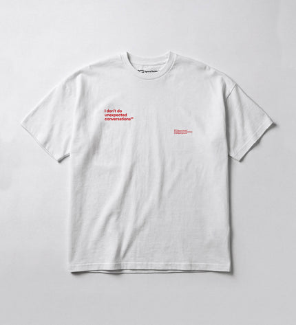White t-shirt with red text on a light gray background
