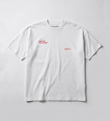 White t-shirt with red text on a light gray background