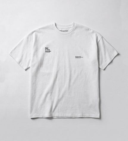 White t-shirt with black text on a light gray background