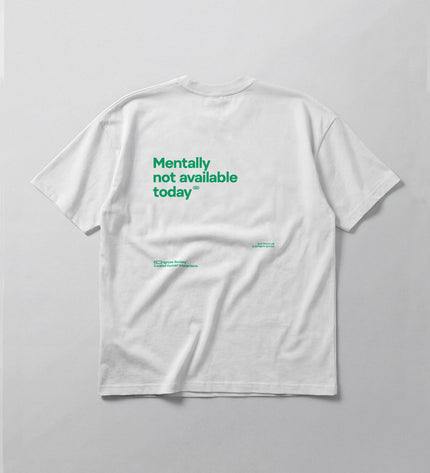 White t-shirt with green text on a gray background