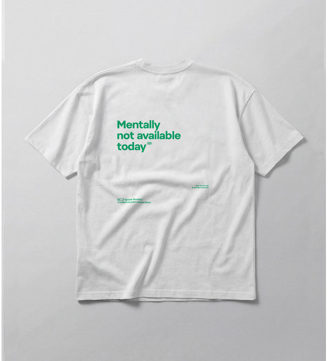 White t-shirt with green text on a gray background