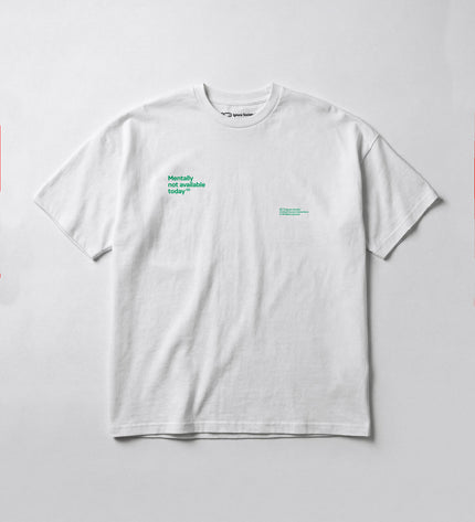 White t-shirt with green text on a light gray background