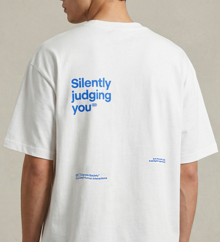 White t-shirt with blue text on the back, worn by a person against a neutral background