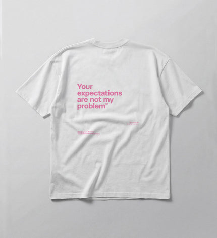 White t-shirt with pink text on a gray background